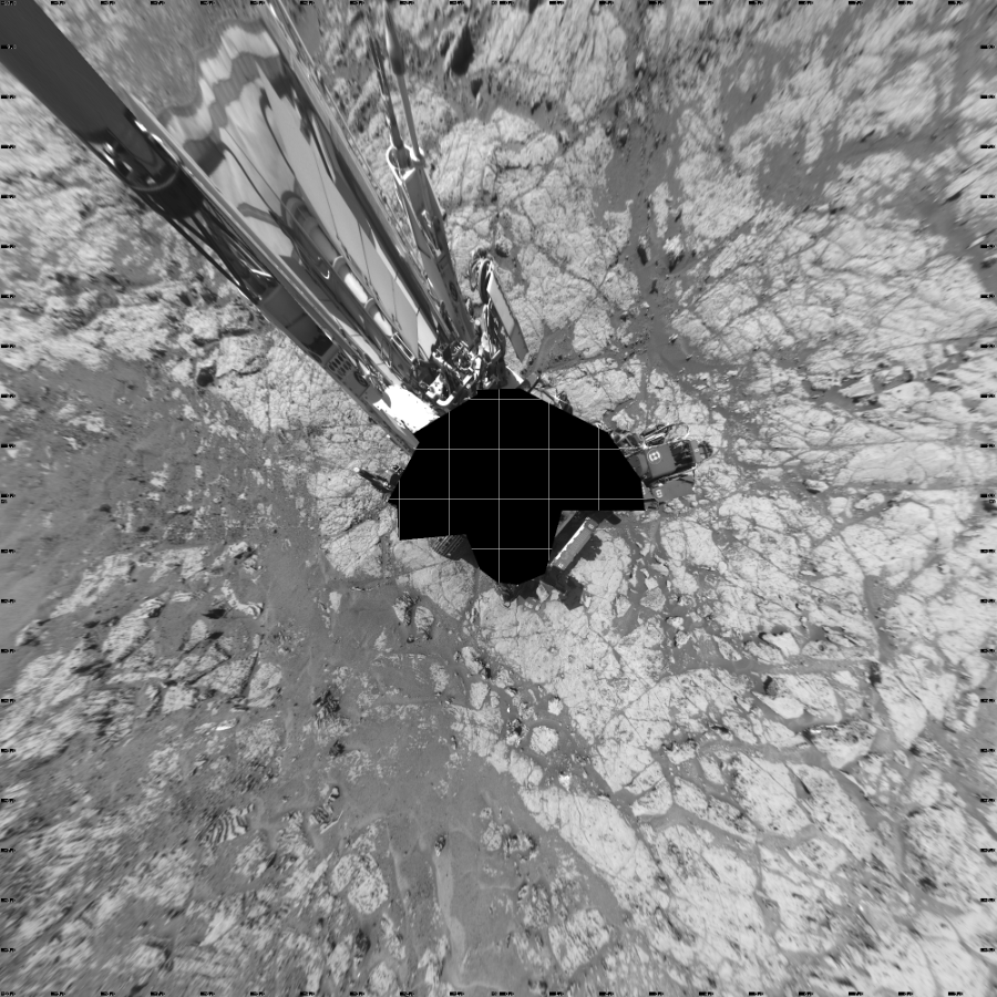 NASA's Mars rover Curiosity took 17 images in Gale Crater using its mast-mounted Left Navigation Camera (Navcam) to create this mosaic. The seam-corrected mosaic provides a vertical projection of the Martian surface near the rover, covering an area of 20 meters (north/south) by 20 meters (east/west). North is up in the image. This projection provides an overhead view, but introduces distortion for items not on the surface, such as large rocks and the rover itself.  Curiosity took the images on November 06, 2017, Sol 1867 of the Mars Science Laboratory mission at drive 2168, site number 66. The local mean solar time for the image exposures was 2 PM. Each Navcam image has a 45-degree field of view. CREDIT: NASA/JPL-Caltech