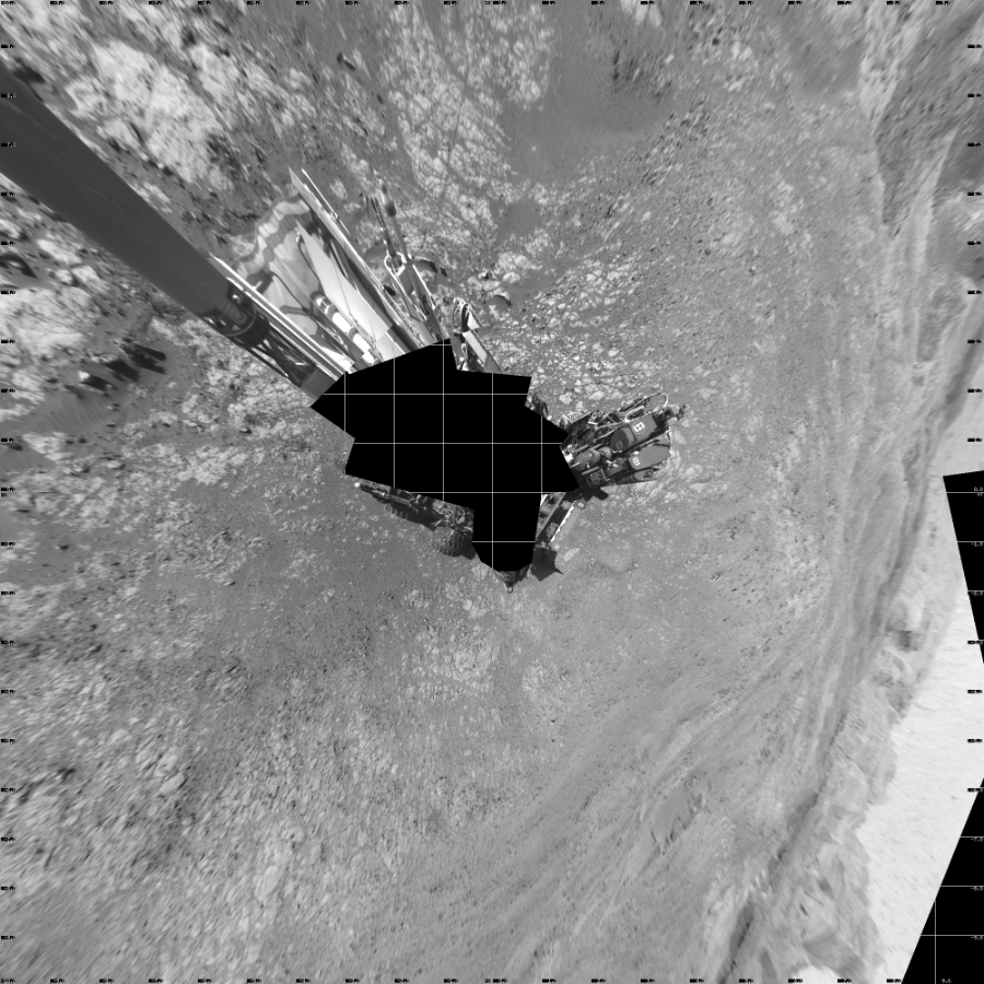 NASA's Mars rover Curiosity took 18 images in Gale Crater using its mast-mounted Left Navigation Camera (Navcam) to create this mosaic. The seam-corrected mosaic provides a vertical projection of the Martian surface near the rover, covering an area of 20 meters (north/south) by 20 meters (east/west). North is up in the image. This projection provides an overhead view, but introduces distortion for items not on the surface, such as large rocks and the rover itself.  Curiosity took the images on November 11, 2017, Sol 1871 of the Mars Science Laboratory mission at drive 2414, site number 66. The local mean solar time for the image exposures was 2 PM. Each Navcam image has a 45-degree field of view. CREDIT: NASA/JPL-Caltech