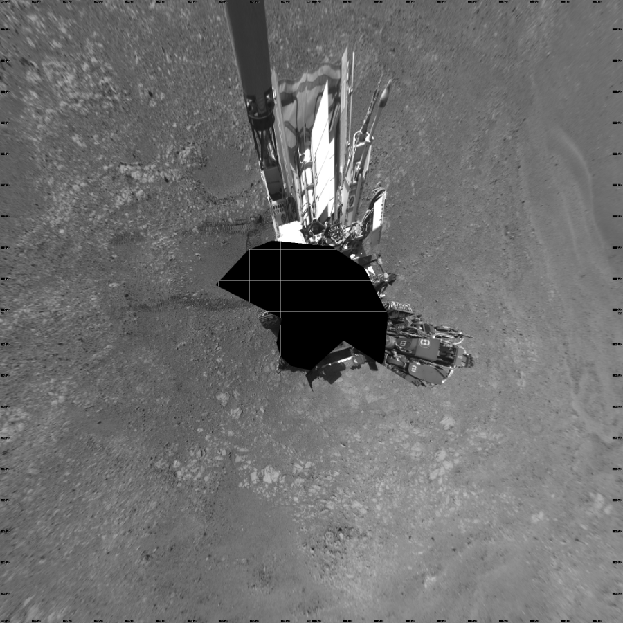 NASA's Mars rover Curiosity took 17 images in Gale Crater using its mast-mounted Left Navigation Camera (Navcam) to create this mosaic. The seam-corrected mosaic provides a vertical projection of the Martian surface near the rover, covering an area of 20 meters (north/south) by 20 meters (east/west). North is up in the image. This projection provides an overhead view, but introduces distortion for items not on the surface, such as large rocks and the rover itself.  Curiosity took the images on December 04, 2017, Sol 1894 of the Mars Science Laboratory mission at drive 806, site number 67. The local mean solar time for the image exposures was 2 PM. Each Navcam image has a 45-degree field of view. CREDIT: NASA/JPL-Caltech