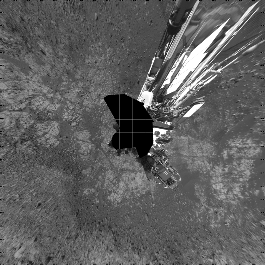NASA's Mars rover Curiosity took 17 images in Gale Crater using its mast-mounted Left Navigation Camera (Navcam) to create this mosaic. The seam-corrected mosaic provides a vertical projection of the Martian surface near the rover, covering an area of 20 meters (north/south) by 20 meters (east/west). North is up in the image. This projection provides an overhead view, but introduces distortion for items not on the surface, such as large rocks and the rover itself.  Curiosity took the images on December 14, 2017, Sol 1903 of the Mars Science Laboratory mission at drive 1358, site number 67. The local mean solar time for the image exposures was from 2 PM to 3 PM. Each Navcam image has a 45-degree field of view. CREDIT: NASA/JPL-Caltech