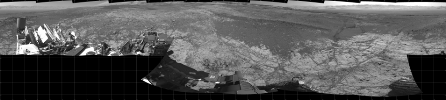 NASA's Mars rover Curiosity took 18 images in Gale Crater using its mast-mounted Left Navigation Camera (Navcam) to create this mosaic. The seam-corrected mosaic provides a 360-degree cylindrical projection panorama of the Martian surface centered at 180 degrees azimuth (measured clockwise from north). Curiosity took the images on January 10, 2018, Sol 1930 of the Mars Science Laboratory mission at drive 2420, site number 67. The local mean solar time for the image exposures was 2 PM. Each Navcam image has a 45 degree field of view. CREDIT: NASA/JPL-Caltech