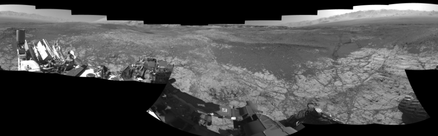 NASA's Mars rover Curiosity took 18 images in Gale Crater using its mast-mounted Left Navigation Camera (Navcam) to create this mosaic. The seam-corrected mosaic provides a 360-degree cylindrical-perspective projection panorama of the Martian surface suitable for stereo viewing, centered at 352 degrees azimuth (measured clockwise from north). This single-eye view must be combined with the partner right image to be viewed in stereo.  Curiosity took the images on January 10, 2018, Sol 1930 of the Mars Science Laboratory mission at drive 2420, site number 67. The local mean solar time for the image exposures was 2 PM. Each Navcam image has a 45-degree field of view. CREDIT: NASA/JPL-Caltech