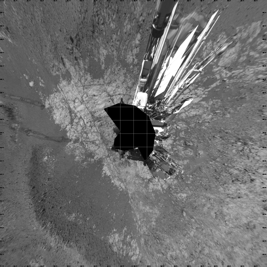 NASA's Mars rover Curiosity took 18 images in Gale Crater using its mast-mounted Left Navigation Camera (Navcam) to create this mosaic. The seam-corrected mosaic provides a vertical projection of the Martian surface near the rover, covering an area of 20 meters (north/south) by 20 meters (east/west). North is up in the image. This projection provides an overhead view, but introduces distortion for items not on the surface, such as large rocks and the rover itself. Curiosity took the images on January 10, 2018, Sol 1930 of the Mars Science Laboratory mission at drive 2420, site number 67. The local mean solar time for the image exposures was 2 PM. Each Navcam image has a 45-degree field of view. CREDIT: NASA/JPL-Caltech