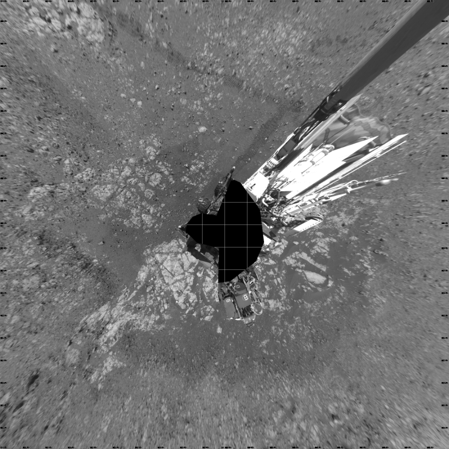 NASA's Mars rover Curiosity took 19 images in Gale Crater using its mast-mounted Left Navigation Camera (Navcam) to create this mosaic. The seam-corrected mosaic provides a vertical projection of the Martian surface near the rover, covering an area of 20 meters (north/south) by 20 meters (east/west). North is up in the image. This projection provides an overhead view, but introduces distortion for items not on the surface, such as large rocks and the rover itself. Curiosity took the images on February 12, 2018, Sol 1962 of the Mars Science Laboratory mission at drive 580, site number 68. The local mean solar time for the image exposures was from 1 PM to 12 PM. Each Navcam image has a 45-degree field of view. CREDIT: NASA/JPL-Caltech