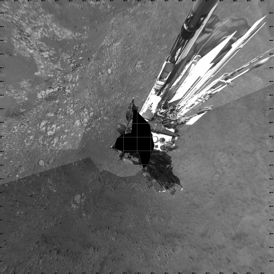 NASA's Mars rover Curiosity took 19 images in Gale Crater using its mast-mounted Left Navigation Camera (Navcam) to create this mosaic. The seam-corrected mosaic provides a vertical projection of the Martian surface near the rover, covering an area of 20 meters (north/south) by 20 meters (east/west). North is up in the image. This projection provides an overhead view, but introduces distortion for items not on the surface, such as large rocks and the rover itself.  Curiosity took the images on March 08, 2018, Sol 1985 of the Mars Science Laboratory mission at drive 772, site number 68. The local mean solar time for the image exposures was 2 PM. Each Navcam image has a 45-degree field of view. CREDIT: NASA/JPL-Caltech