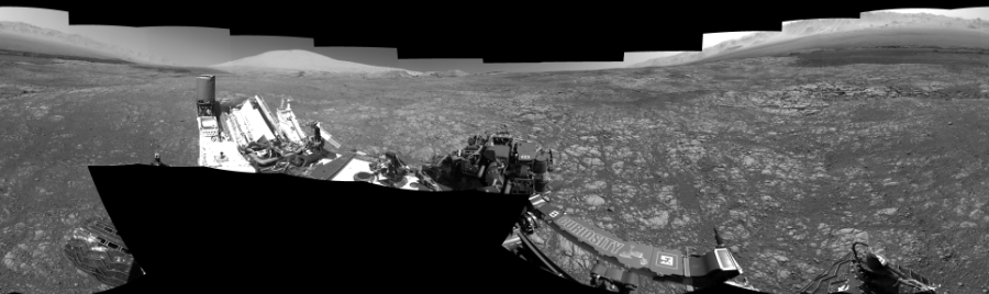 NASA's Mars rover Curiosity took 17 images in Gale Crater using its mast-mounted Left Navigation Camera (Navcam) to create this mosaic. The seam-corrected mosaic provides a 360-degree cylindrical-perspective projection panorama of the Martian surface suitable for stereo viewing, centered at 294 degrees azimuth (measured clockwise from north). This single-eye view must be combined with the partner right image to be viewed in stereo.  Curiosity took the images on March 19, 2018, Sol 1996 of the Mars Science Laboratory mission at drive 2396, site number 68. The local mean solar time for the image exposures was 2 PM. Each Navcam image has a 45-degree field of view. CREDIT: NASA/JPL-Caltech