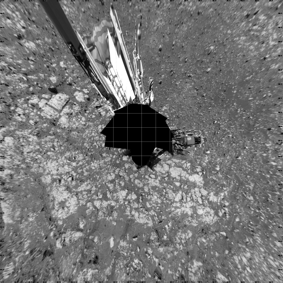 NASA's Mars rover Curiosity took 18 images in Gale Crater using its mast-mounted Left Navigation Camera (Navcam) to create this mosaic. The seam-corrected mosaic provides a vertical projection of the Martian surface near the rover, covering an area of 20 meters (north/south) by 20 meters (east/west). North is up in the image. This projection provides an overhead view, but introduces distortion for items not on the surface, such as large rocks and the rover itself.  Curiosity took the images on March 22, 2018, Sols 1999-2000 of the Mars Science Laboratory mission at drive 2626, site number 68. The local mean solar time for the image exposures was from 1 PM to 11 AM. Each Navcam image has a 45-degree field of view. CREDIT: NASA/JPL-Caltech