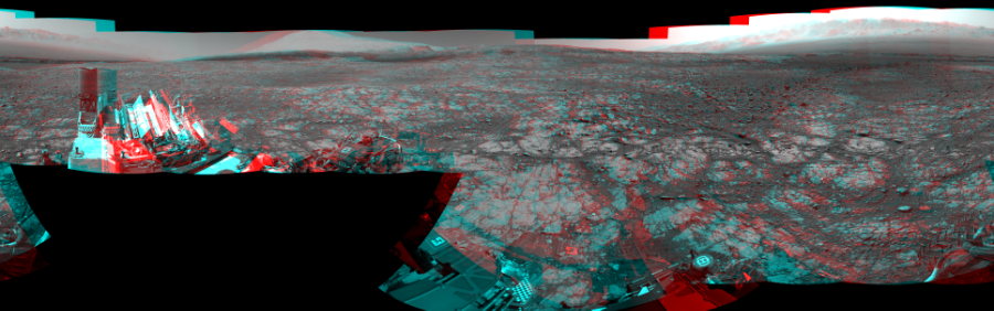 NASA's Mars rover Curiosity took 18 image pairs in Gale Crater using its mast-mounted Navigation Camera (Navcam) to create this mosaic. The seam-corrected mosaic provides a 360-degree cylindrical perspective projection panorama of the Martian surface suitable for stereo viewing, centered at 329 degrees azimuth (measured clockwise from north). This anaglyph must be viewed with red/blue glasses (red over left eye). Curiosity took the images on March 27, 2018, Sol 2004 of the Mars Science Laboratory mission at drive 408, site number 69. The local mean solar time for the image exposures was from 1 PM to 3 PM. Each Navcam image has a 45-degree field of view. CREDIT: NASA/JPL-Caltech