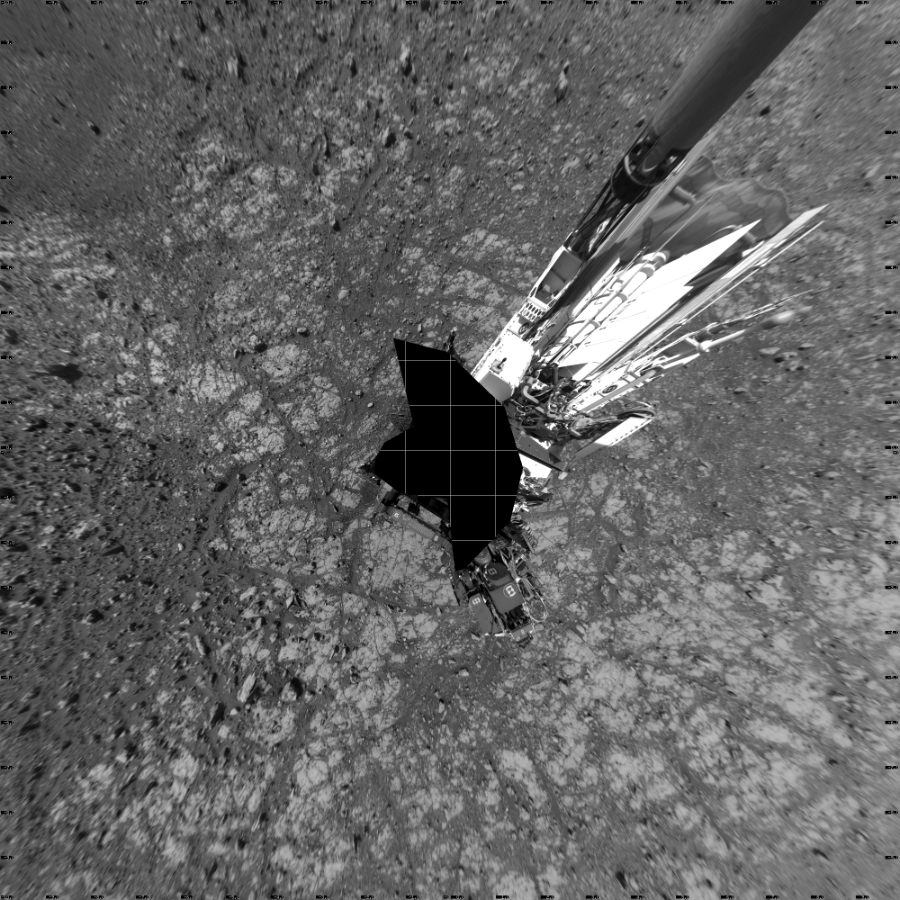 NASA's Mars rover Curiosity took 18 images in Gale Crater using its mast-mounted Left Navigation Camera (Navcam) to create this mosaic. The seam-corrected mosaic provides a vertical projection of the Martian surface near the rover, covering an area of 20 meters (north/south) by 20 meters (east/west). North is up in the image. This projection provides an overhead view, but introduces distortion for items not on the surface, such as large rocks and the rover itself.  Curiosity took the images on March 27, 2018, Sol 2004 of the Mars Science Laboratory mission at drive 408, site number 69. The local mean solar time for the image exposures was from 1 PM to 3 PM. Each Navcam image has a 45-degree field of view. CREDIT: NASA/JPL-Caltech
