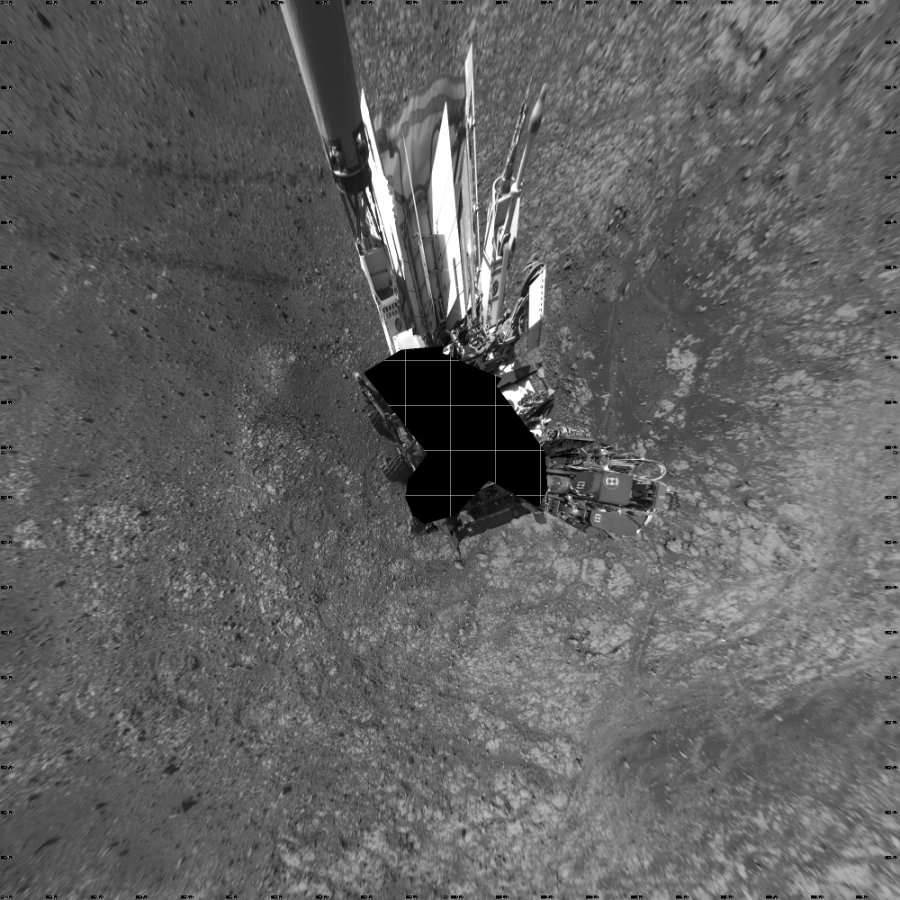 NASA's Mars rover Curiosity took 19 images in Gale Crater using its mast-mounted Left Navigation Camera (Navcam) to create this mosaic. The seam-corrected mosaic provides a vertical projection of the Martian surface near the rover, covering an area of 20 meters (north/south) by 20 meters (east/west). North is up in the image. This projection provides an overhead view, but introduces distortion for items not on the surface, such as large rocks and the rover itself.  Curiosity took the images on March 30, 2018, Sol 2007 of the Mars Science Laboratory mission at drive 714, site number 69. The local mean solar time for the image exposures was from 2 PM to 4 PM. Each Navcam image has a 45-degree field of view. CREDIT: NASA/JPL-Caltech