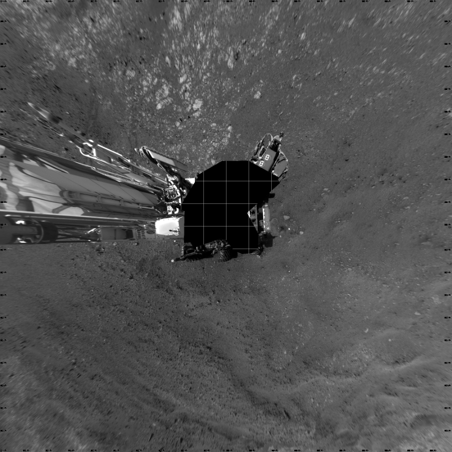 NASA's Mars rover Curiosity took 19 images in Gale Crater using its mast-mounted Left Navigation Camera (Navcam) to create this mosaic. The seam-corrected mosaic provides a vertical projection of the Martian surface near the rover, covering an area of 20 meters (north/south) by 20 meters (east/west). North is up in the image. This projection provides an overhead view, but introduces distortion for items not on the surface, such as large rocks and the rover itself. Curiosity took the images on April 07, 2018, Sol 2014 of the Mars Science Laboratory mission at drive 1552, site number 69. The local mean solar time for the image exposures was 3 PM. Each Navcam image has a 45-degree field of view. CREDIT: NASA/JPL-Caltech