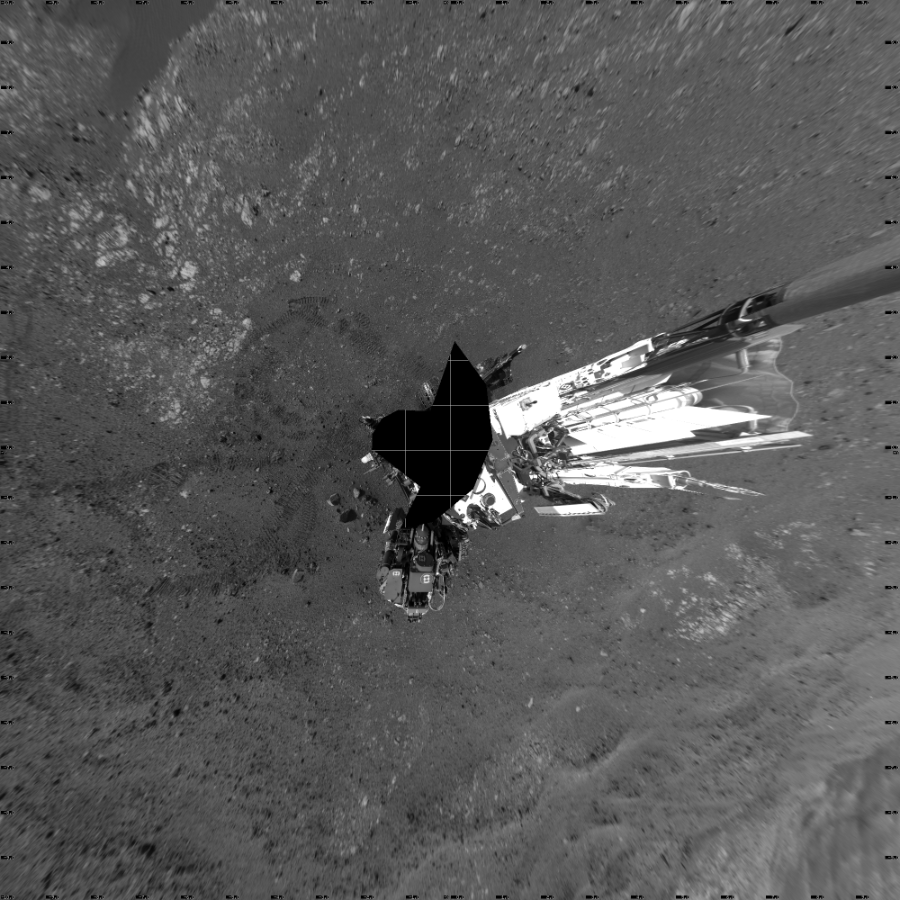 NASA's Mars rover Curiosity took 17 images in Gale Crater using its mast-mounted Left Navigation Camera (Navcam) to create this mosaic. The seam-corrected mosaic provides a vertical projection of the Martian surface near the rover, covering an area of 20 meters (north/south) by 20 meters (east/west). North is up in the image. This projection provides an overhead view, but introduces distortion for items not on the surface, such as large rocks and the rover itself. Curiosity took the images on April 10, 2018, Sol 2017 of the Mars Science Laboratory mission at drive 1648, site number 69. The local mean solar time for the image exposures was 2 PM. Each Navcam image has a 45-degree field of view. CREDIT: NASA/JPL-Caltech