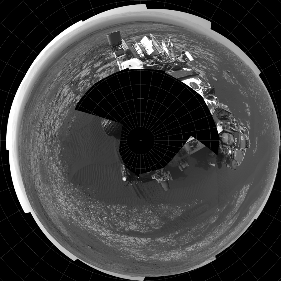 NASA's Mars rover Curiosity took 18 images in Gale Crater using its mast-mounted Left Navigation Camera (Navcam) to create this mosaic. The seam-corrected mosaic provides a polar stereographic projection panorama of the Martian surface with 0 degrees azimuth (measured clockwise from north) at the top of the image. Curiosity took the images on April 16, 2018, Sol 2023 of the Mars Science Laboratory mission at drive 1858, site number 69. The local mean solar time for the image exposures was from 2 PM to 4 PM. Each Navcam image has a 45-degree field of view. CREDIT: NASA/JPL-Caltech