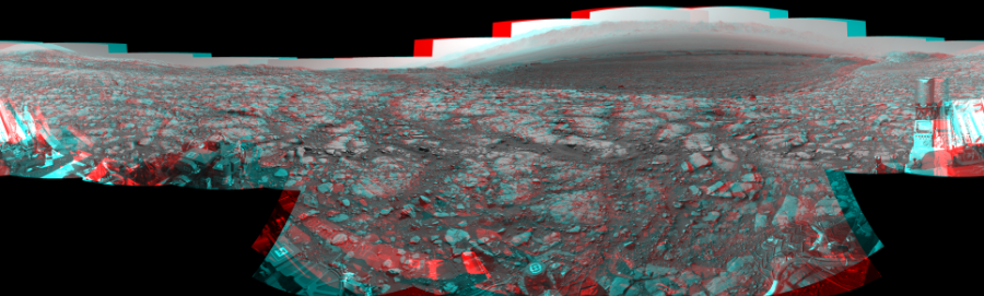 NASA's Mars rover Curiosity took 17 image pairs in Gale Crater using its mast-mounted Navigation Camera (Navcam) to create this mosaic. The seam-corrected mosaic provides a 360-degree cylindrical perspective projection panorama of the Martian surface suitable for stereo viewing, centered at 24 degrees azimuth (measured clockwise from north). This anaglyph must be viewed with red/blue glasses (red over left eye). Curiosity took the images on May 03, 2018, Sol 2040 of the Mars Science Laboratory mission at drive 886, site number 70. The local mean solar time for the image exposures was from 2 PM to 3 PM. Each Navcam image has a 45-degree field of view. CREDIT: NASA/JPL-Caltech