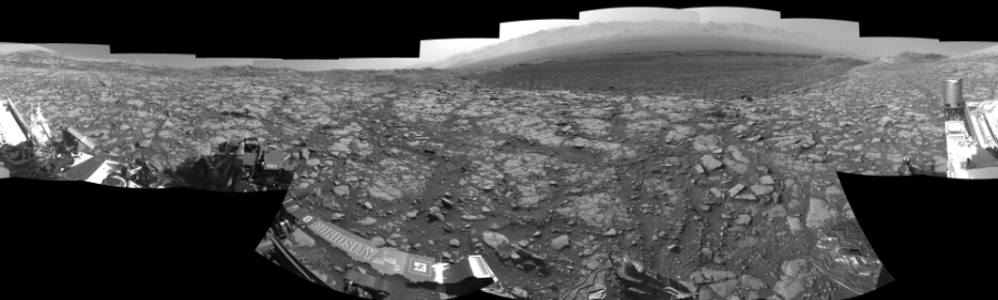 NASA's Mars rover Curiosity took 17 images in Gale Crater using its mast-mounted Left Navigation Camera (Navcam) to create this mosaic. The seam-corrected mosaic provides a 360-degree cylindrical-perspective projection panorama of the Martian surface suitable for stereo viewing, centered at 24 degrees azimuth (measured clockwise from north). This single-eye view must be combined with the partner right image to be viewed in stereo.  Curiosity took the images on May 03, 2018, Sol 2040 of the Mars Science Laboratory mission at drive 886, site number 70. The local mean solar time for the image exposures was from 2 PM to 3 PM. Each Navcam image has a 45-degree field of view. CREDIT: NASA/JPL-Caltech