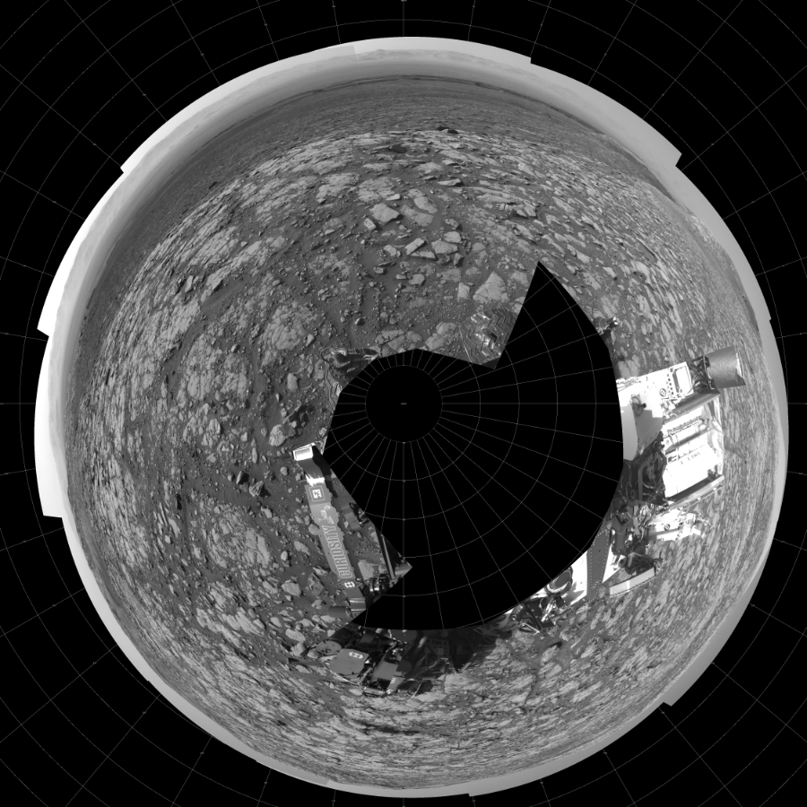 NASA's Mars rover Curiosity took 17 images in Gale Crater using its mast-mounted Left Navigation Camera (Navcam) to create this mosaic. The seam-corrected mosaic provides a polar stereographic projection panorama of the Martian surface with 0 degrees azimuth (measured clockwise from north) at the top of the image. Curiosity took the images on May 03, 2018, Sol 2040 of the Mars Science Laboratory mission at drive 886, site number 70. The local mean solar time for the image exposures was from 2 PM to 3 PM. Each Navcam image has a 45-degree field of view. CREDIT: NASA/JPL-Caltech