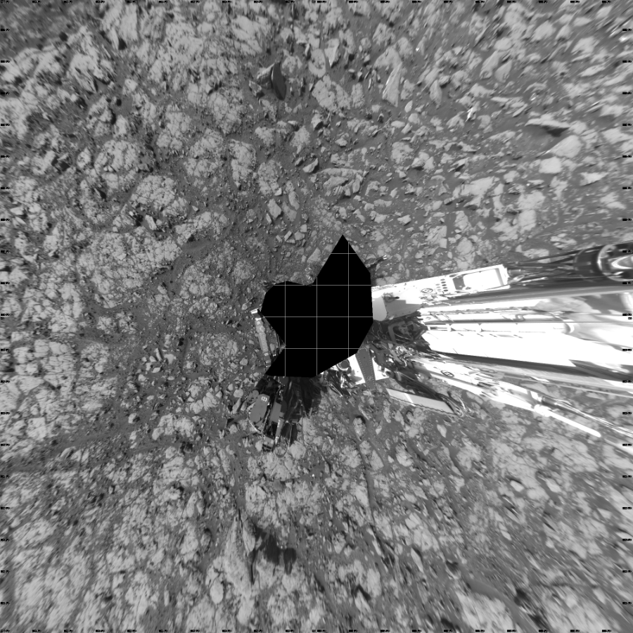 NASA's Mars rover Curiosity took 17 images in Gale Crater using its mast-mounted Left Navigation Camera (Navcam) to create this mosaic. The seam-corrected mosaic provides a vertical projection of the Martian surface near the rover, covering an area of 20 meters (north/south) by 20 meters (east/west). North is up in the image. This projection provides an overhead view, but introduces distortion for items not on the surface, such as large rocks and the rover itself.  Curiosity took the images on May 03, 2018, Sol 2040 of the Mars Science Laboratory mission at drive 886, site number 70. The local mean solar time for the image exposures was from 2 PM to 3 PM. Each Navcam image has a 45-degree field of view. CREDIT: NASA/JPL-Caltech