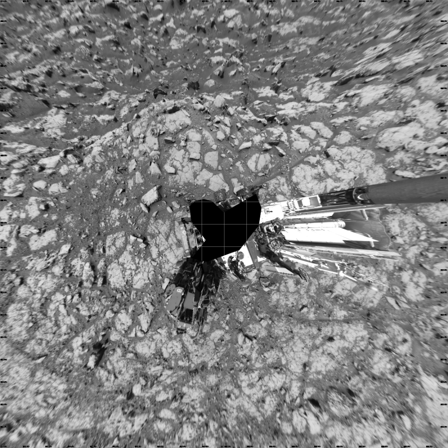 NASA's Mars rover Curiosity took 19 images in Gale Crater using its mast-mounted Left Navigation Camera (Navcam) to create this mosaic. The seam-corrected mosaic provides a vertical projection of the Martian surface near the rover, covering an area of 20 meters (north/south) by 20 meters (east/west). North is up in the image. This projection provides an overhead view, but introduces distortion for items not on the surface, such as large rocks and the rover itself. Curiosity took the images on May 07, 2018, Sol 2044 of the Mars Science Laboratory mission at drive 1138, site number 70. The local mean solar time for the image exposures was 1 PM. Each Navcam image has a 45-degree field of view. CREDIT: NASA/JPL-Caltech