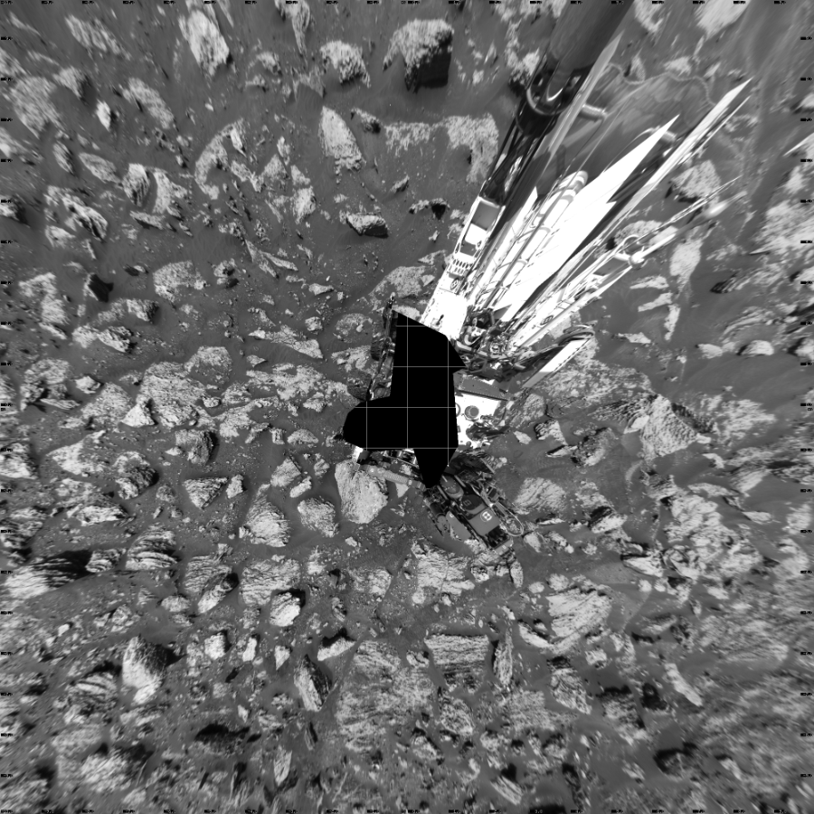 NASA's Mars rover Curiosity took 19 images in Gale Crater using its mast-mounted Left Navigation Camera (Navcam) to create this mosaic. The seam-corrected mosaic provides a vertical projection of the Martian surface near the rover, covering an area of 20 meters (north/south) by 20 meters (east/west). North is up in the image. This projection provides an overhead view, but introduces distortion for items not on the surface, such as large rocks and the rover itself.  Curiosity took the images on May 10, 2018, Sol 2047 of the Mars Science Laboratory mission at drive 1538, site number 70. The local mean solar time for the image exposures was 1 PM. Each Navcam image has a 45-degree field of view. CREDIT: NASA/JPL-Caltech
