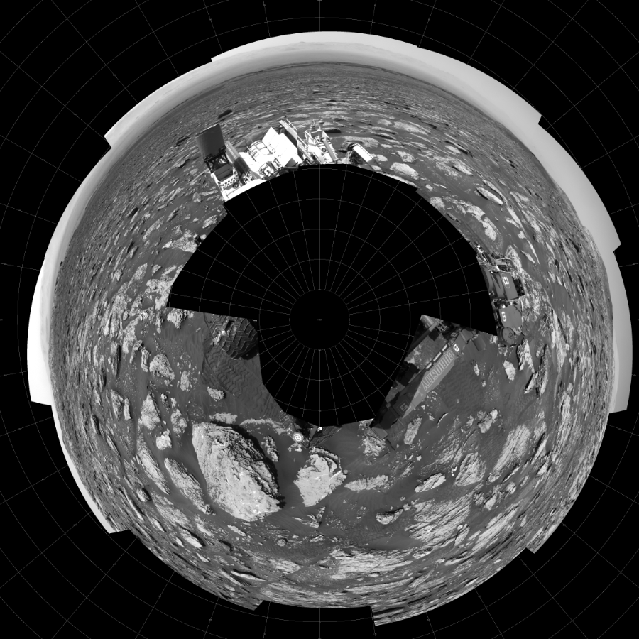NASA's Mars rover Curiosity took 17 images in Gale Crater using its mast-mounted Left Navigation Camera (Navcam) to create this mosaic. The seam-corrected mosaic provides a polar stereographic projection panorama of the Martian surface with 0 degrees azimuth (measured clockwise from north) at the top of the image. Curiosity took the images on May 15, 2018, Sol 2051 of the Mars Science Laboratory mission at drive 1554, site number 70. The local mean solar time for the image exposures was 1 PM. Each Navcam image has a 45-degree field of view. CREDIT: NASA/JPL-Caltech