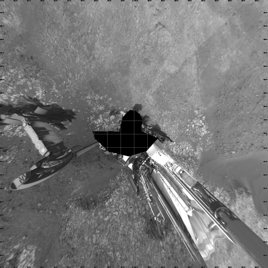 NASA's Mars rover Curiosity took 21 images in Gale Crater using its mast-mounted Left Navigation Camera (Navcam) to create this mosaic. The seam-corrected mosaic provides a vertical projection of the Martian surface near the rover, covering an area of 20 meters (north/south) by 20 meters (east/west). North is up in the image. This projection provides an overhead view, but introduces distortion for items not on the surface, such as large rocks and the rover itself.  Curiosity took the images on October 29, 2018, Sols 2214-2218 of the Mars Science Laboratory mission at drive 0, site number 73. The local mean solar time for the image exposures was from 2 PM to 4 PM. Each Navcam image has a 45-degree field of view. CREDIT: NASA/JPL-Caltech