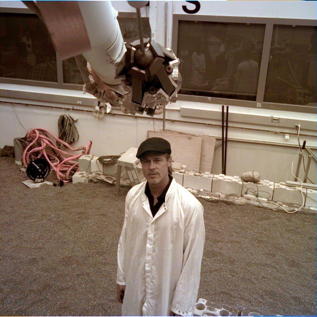 The engineering model of NASA's InSight lander took an image of the actor Brad Pitt at JPL on Sept. 6, 2019, using the instrument deployment camera on the replica's robotic arm. Pitt visited JPL to learn about real space technology after filming his space-themed movie "Ad Astra."