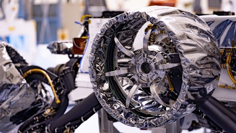 A close-up view of a Perseverance rover's wheel
