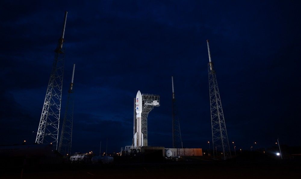 The rocket with NASA’s Mars 2020 Perseverance rover onboard is seen illuminated by spotlights on the launch pad at Space Launch Complex 41