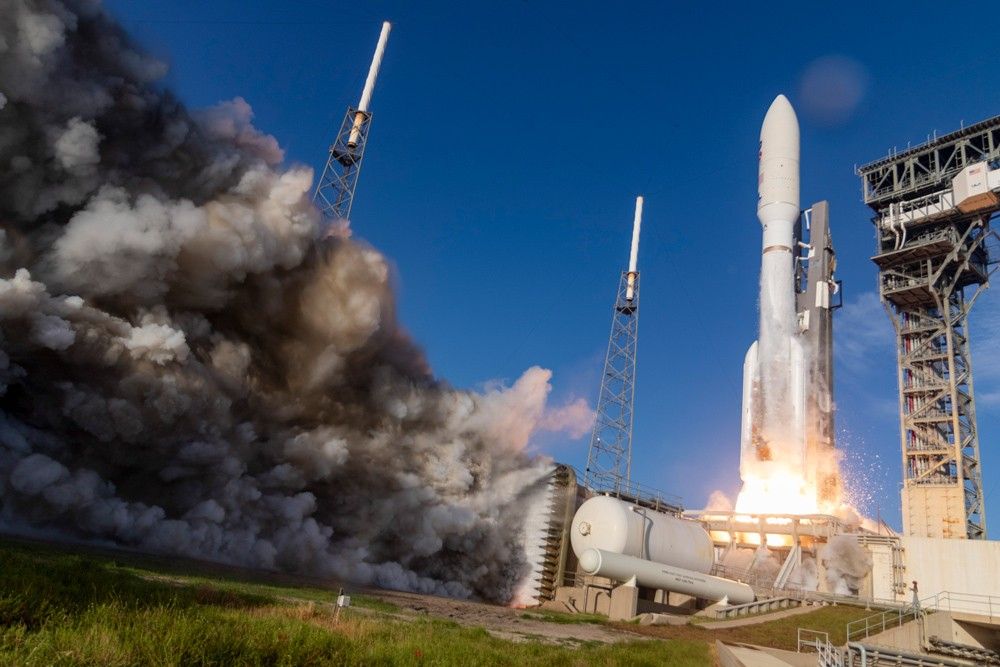 The rocket carrying the Mars 2020 mission lifts off from KSC