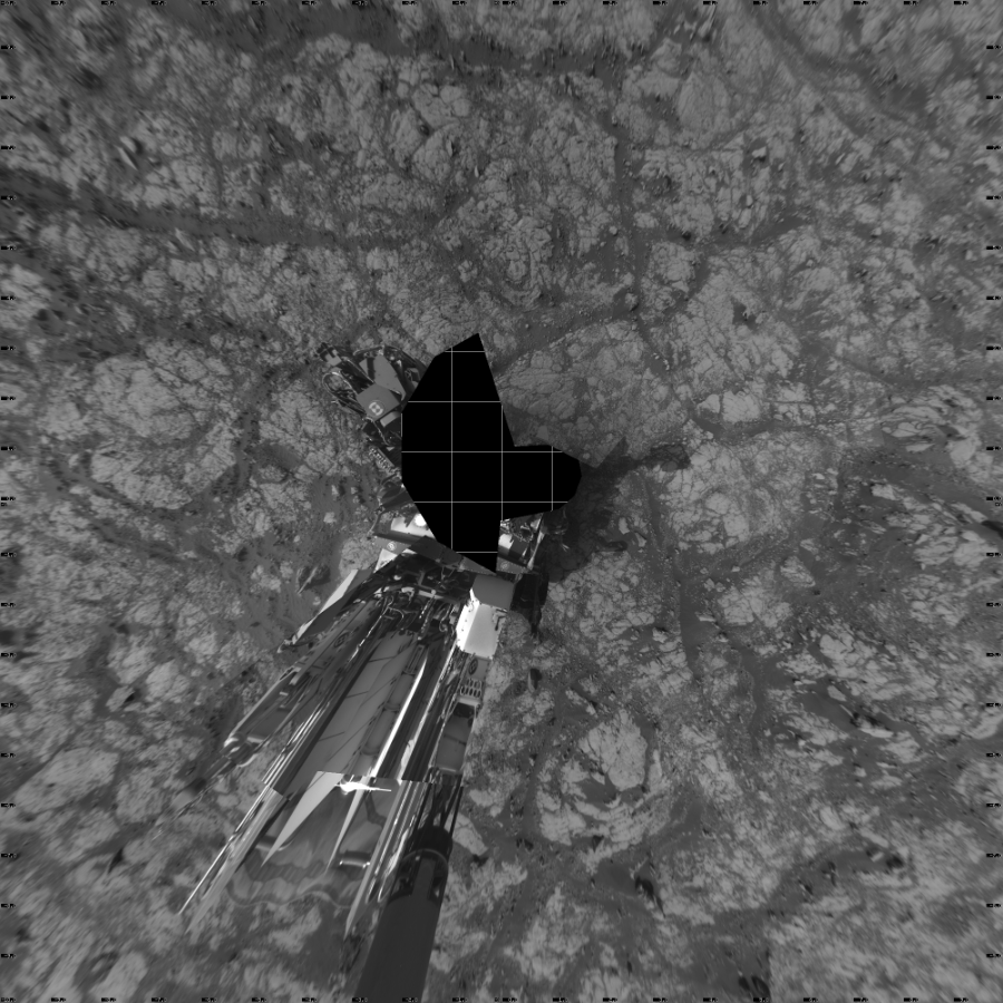 NASA's Mars rover Curiosity took 24 images in Gale Crater using its mast-mounted Right Navigation Camera (Navcam) to create this mosaic. The seam-corrected mosaic provides a vertical projection of the Martian surface near the rover, covering an area of 20 meters (north/south) by 20 meters (east/west). North is up in the image. This projection provides an overhead view, but introduces distortion for items not on the surface, such as large rocks and the rover itself.  Curiosity took the images on May 01, 2020, Sols 2749-2747 of the Mars Science Laboratory mission at drive 2008, site number 79. The local mean solar time for the image exposures was from 3 PM to 12 PM. Each Navcam image has a 45-degree field of view. CREDIT: NASA/JPL-Caltech