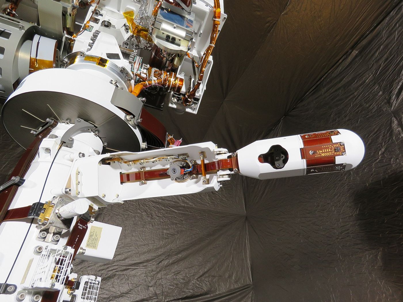 MEDA's Wind Sensor 2 seems to be practicing its deployment as if already on Mars.