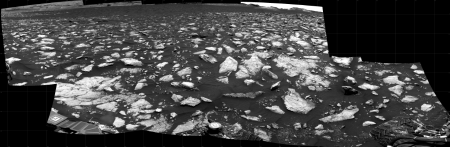 NASA's Mars rover Curiosity took 10 images in Gale Crater using its mast-mounted Right Navigation Camera (Navcam) to create this mosaic. The seam-corrected mosaic provides a 232-degree cylindrical projection panorama of the Martian surface centered at 212 degrees azimuth (measured clockwise from north). Curiosity took the images on December 21, 2020, Sol 2977 of the Mars Science Laboratory mission at drive 1804, site number 84. The local mean solar time for the image exposures was from 1 PM to 2 PM. Each Navcam image has a 45 degree field of view. CREDIT: NASA/JPL-Caltech
