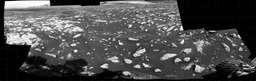 NASA's Mars rover Curiosity took 10 images in Gale Crater using its mast-mounted Right Navigation Camera (Navcam) to create this mosaic. The seam-corrected mosaic provides a 242-degree cylindrical projection panorama of the Martian surface centered at 145 degrees azimuth (measured clockwise from north). Curiosity took the images on February 24, 2021, Sol 3040 of the Mars Science Laboratory mission at drive 2302, site number 86. The local mean solar time for the image exposures was 3 PM. Each Navcam image has a 45 degree field of view. CREDIT: NASA/JPL-Caltech