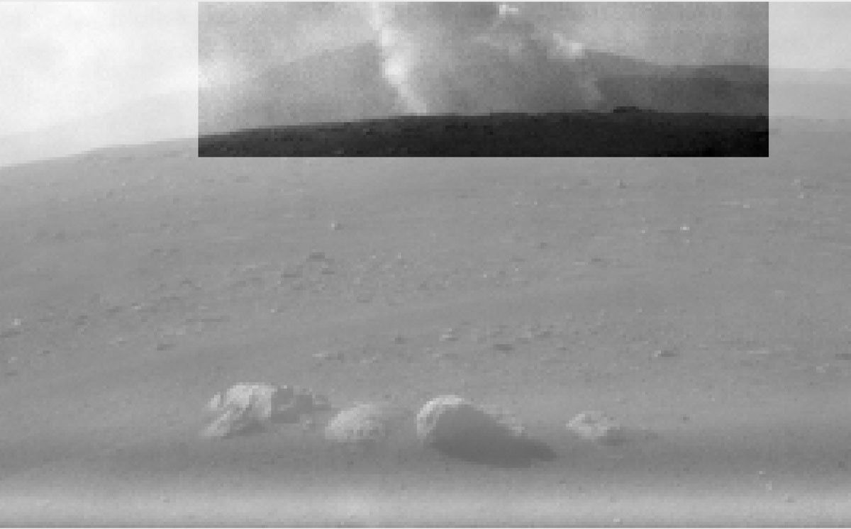 This image from one of the rear Hazard Cameras, or Hazcams, aboard NASA's Perseverance Mars rover, shows a smoke plume from the crashed descent stage that lowered the rover to the Martian surface.