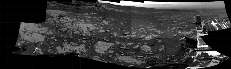 NASA's Mars rover Curiosity took 14 images in Gale Crater using its mast-mounted Right Navigation Camera (Navcam) to create this mosaic. The seam-corrected mosaic provides a 286-degree cylindrical projection panorama of the Martian surface centered at 253 degrees azimuth (measured clockwise from north). Curiosity took the images on March 05, 2021, Sol 3049 of the Mars Science Laboratory mission at drive 696, site number 87. The local mean solar time for the image exposures was 4 PM. Each Navcam image has a 45 degree field of view. CREDIT: NASA/JPL-Caltech