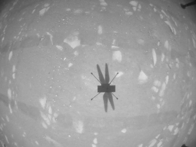 The Ingenuity Mars Helicopter’s navigation camera captures the helicopter’s shadow on the surface of Jezero Crater during rotorcraft’s second experimental test flight on April 22, 2021.