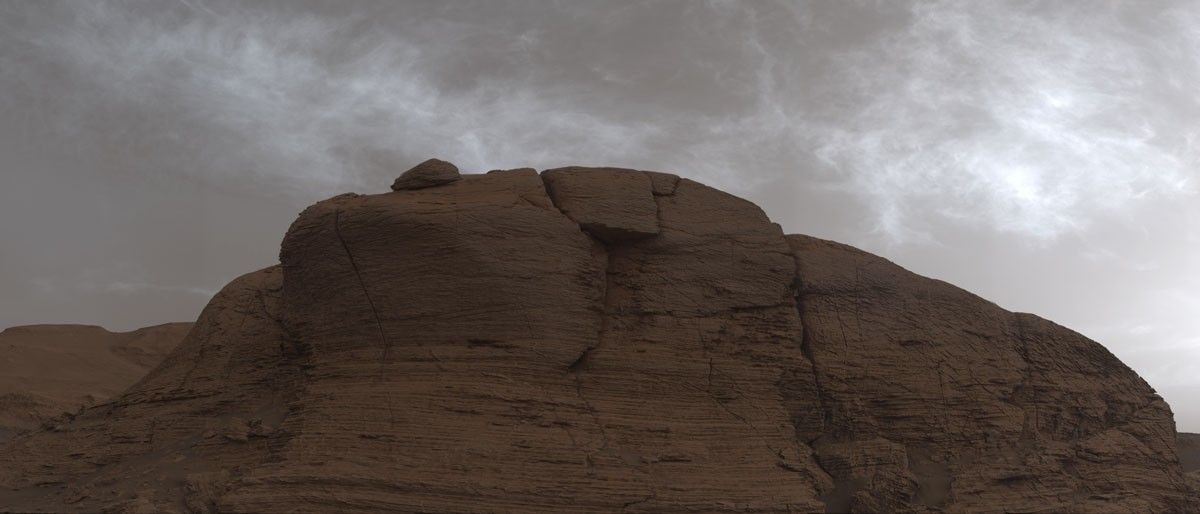 NASA’s Curiosity Mars rover captured these clouds just after sunset on March 19, 2021, the 3,063rd Martian day, or sol, of the rover’s mission. The image is made up of 21 individual images stitched together and color corrected so that the scene appears as it would to the human eye.