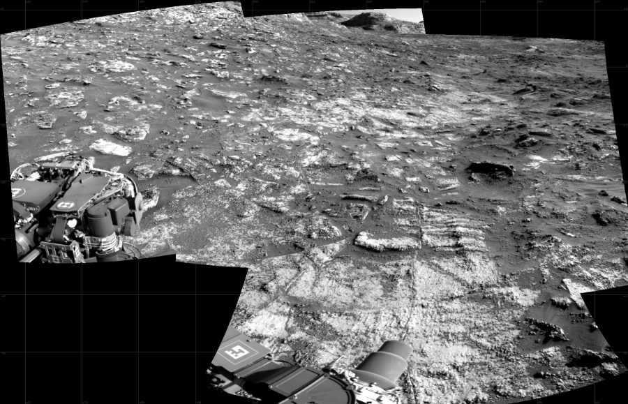 NASA's Mars rover Curiosity took 4 images in Gale Crater using its mast-mounted Right Navigation Camera (Navcam) to create this mosaic. The seam-corrected mosaic provides a 110-degree cylindrical projection panorama of the Martian surface centered at 211 degrees azimuth (measured clockwise from north). Curiosity took the images on August 04, 2021, Sol 3197 of the Mars Science Laboratory mission at drive 772, site number 90. The local mean solar time for the image exposures was 3 PM. Each Navcam image has a 45 degree field of view. CREDIT: NASA/JPL-Caltech