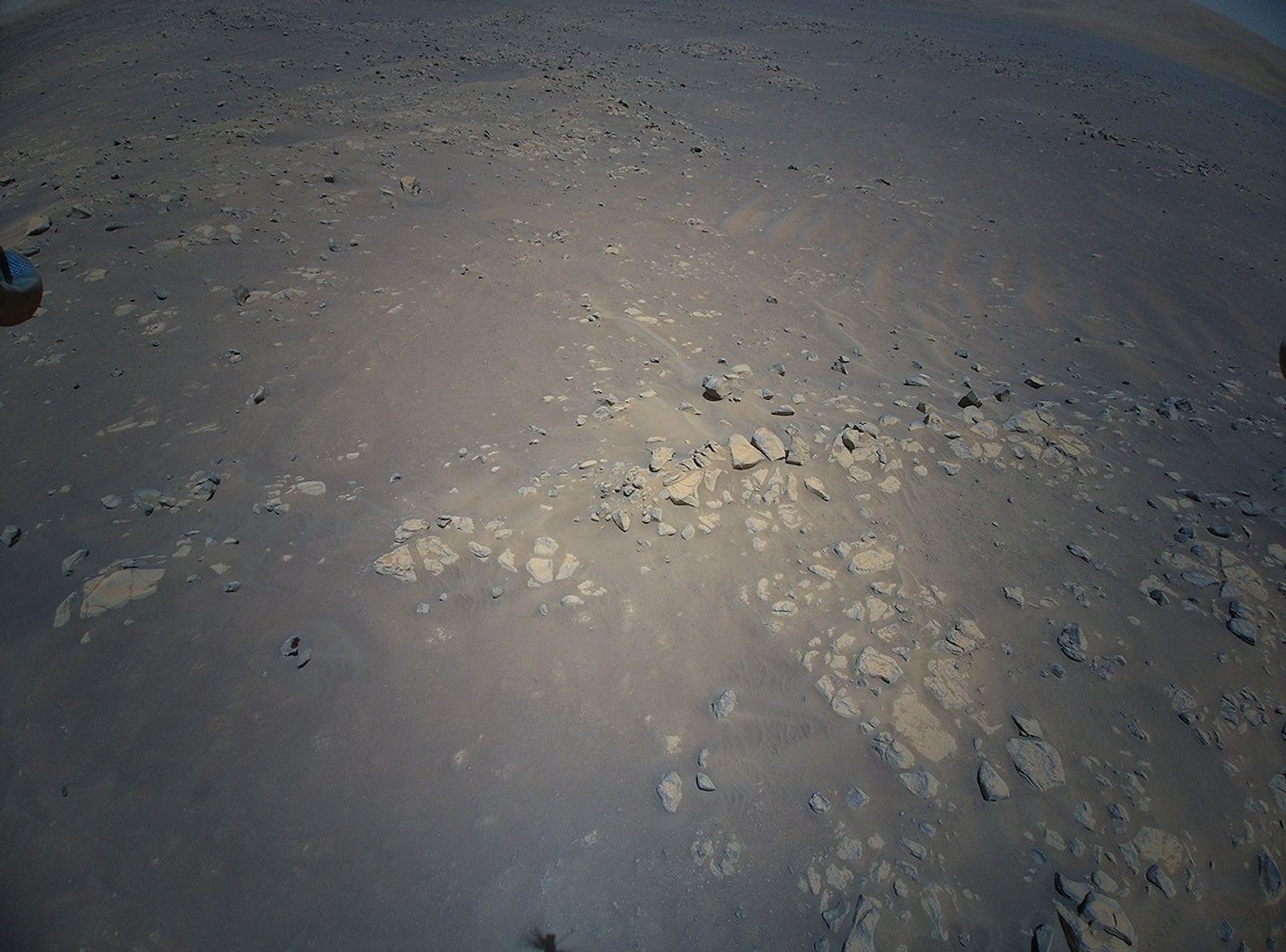 The Return to Earth camera on NASA’s Ingenuity Mars Helicopter snaped this picture of geologic feature the Mars Perseverance rover team calls “Raised Ridges” during its 10th flight at Mars, on July 24, 2021.