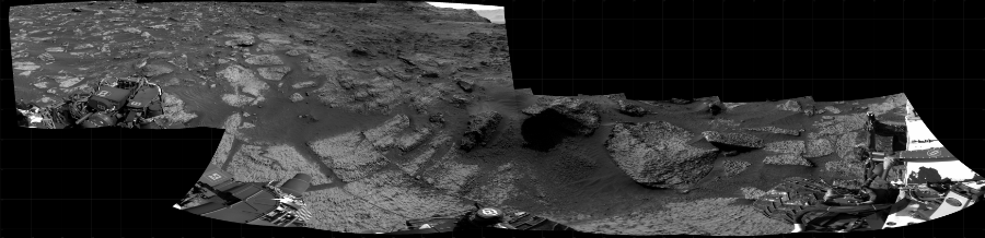 NASA's Mars rover Curiosity took 12 images in Gale Crater using its mast-mounted Right Navigation Camera (Navcam) to create this mosaic. The seam-corrected mosaic provides a 328-degree cylindrical projection panorama of the Martian surface centered at 293 degrees azimuth (measured clockwise from north). Curiosity took the images on August 06, 2021, Sol 3199 of the Mars Science Laboratory mission at drive 892, site number 90. The local mean solar time for the image exposures was from 2 PM to 3 PM. Each Navcam image has a 45 degree field of view. CREDIT: NASA/JPL-Caltech