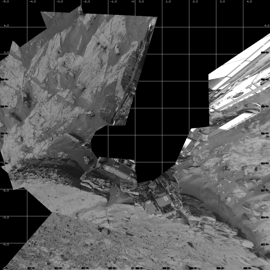NASA's Mars rover Curiosity took 11 images in Gale Crater using its mast-mounted Left Navigation Camera (Navcam) to create this mosaic. The seam-corrected mosaic provides a vertical projection of the Martian surface near the rover, covering an area of 10 meters (north/south) by 10 meters (east/west). North is up in the image. This projection provides an overhead view, but introduces distortion for items not on the surface, such as large rocks and the rover itself.  Curiosity took the images on January 12, 2022, Sol 3354 of the Mars Science Laboratory mission at drive 2272, site number 92. The local mean solar time for the image exposures was 2 PM. Each Navcam image has a 45-degree field of view. CREDIT: NASA/JPL-Caltech