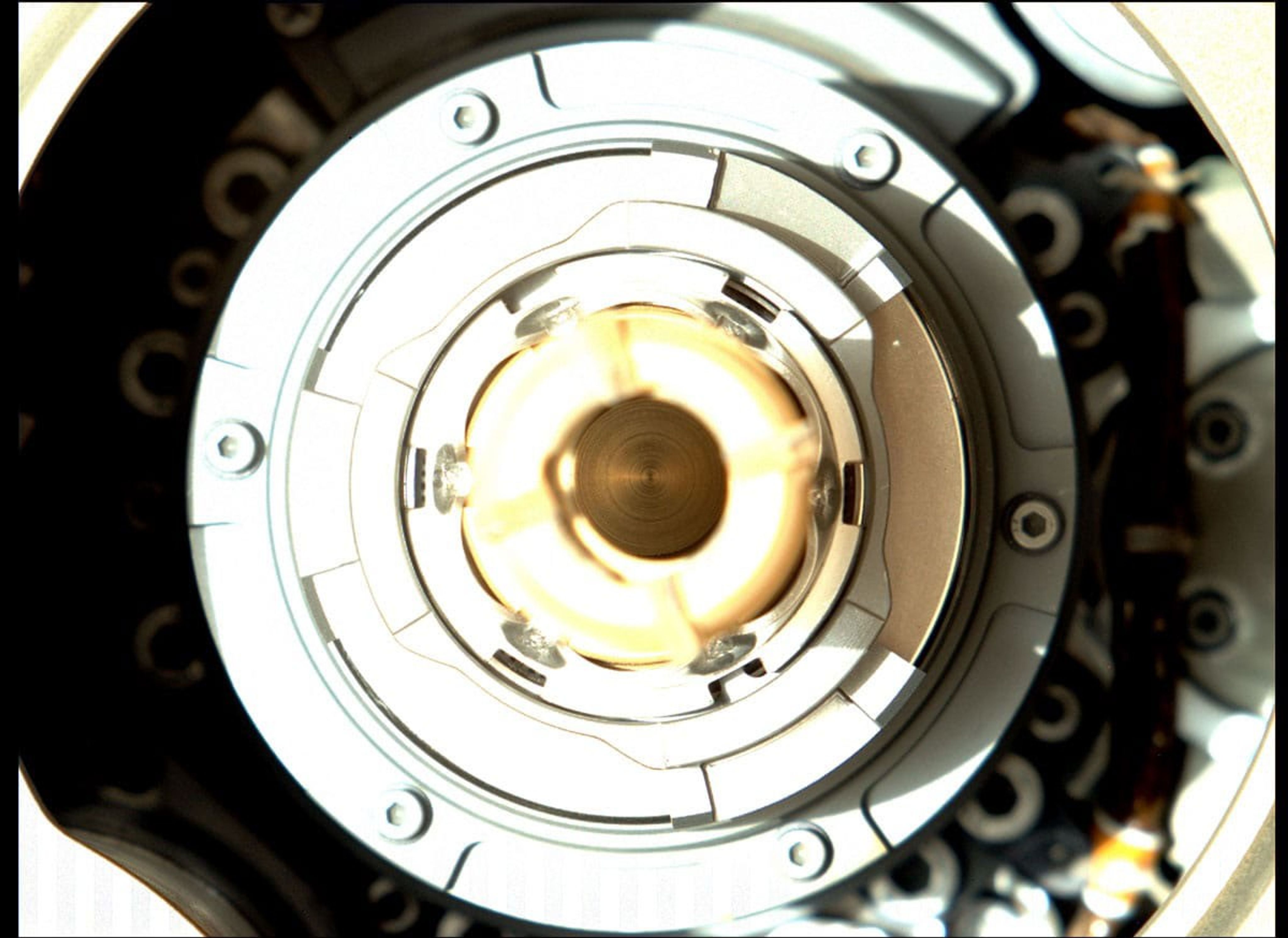 This image, taken by the Mastcam-Z camera aboard NASA's Perseverance Mars rover on Jan. 20, 2022, shows the rover successfully expelled the remaining large fragments of cored rock from a sample tube held in its drill.