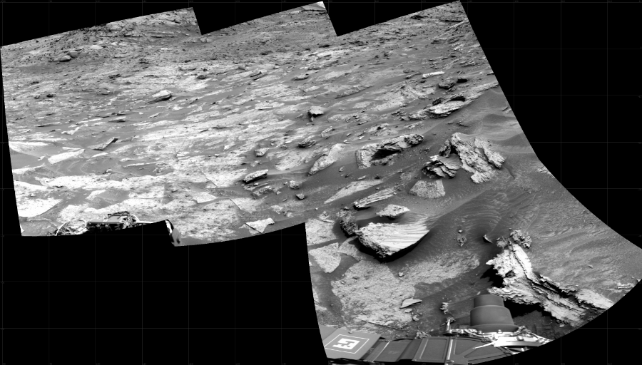 NASA's Mars rover Curiosity took 4 images in Gale Crater using its mast-mounted Right Navigation Camera (Navcam) to create this mosaic. The seam-corrected mosaic provides a 138-degree cylindrical projection panorama of the Martian surface centered at 149 degrees azimuth (measured clockwise from north). Curiosity took the images on May 02, 2022, Sol 3461 of the Mars Science Laboratory mission at drive 2242, site number 94. The local mean solar time for the image exposures was 1 PM. Each Navcam image has a 45 degree field of view. CREDIT: NASA/JPL-Caltech