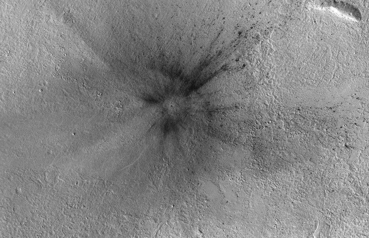 This meteoroid impact crater on Mars was discovered using the black-and-white Context Camera aboard NASA’s Mars Reconnaissance Orbiter.