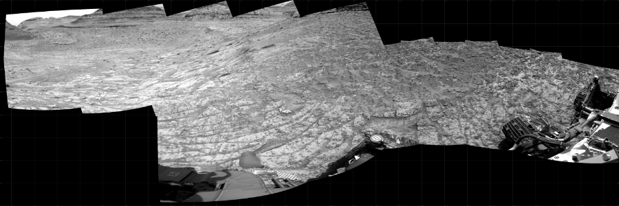 NASA's Mars rover Curiosity took 12 images in Gale Crater using its mast-mounted Right Navigation Camera (Navcam) to create this mosaic. The seam-corrected mosaic provides a 272-degree cylindrical projection panorama of the Martian surface centered at 171 degrees azimuth (measured clockwise from north). Curiosity took the images on January 06, 2023, Sol 3703 of the Mars Science Laboratory mission at drive 740, site number 99. The local mean solar time for the image exposures was 2 PM. Each Navcam image has a 45 degree field of view. CREDIT: NASA/JPL-Caltech