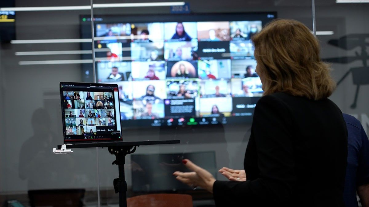 Image inside the control room for NASA's Perseverance rover showing NASA's Jet Propulsion Laboratory Director Dr. Laurie Leshin interacting virtually with student honorees.