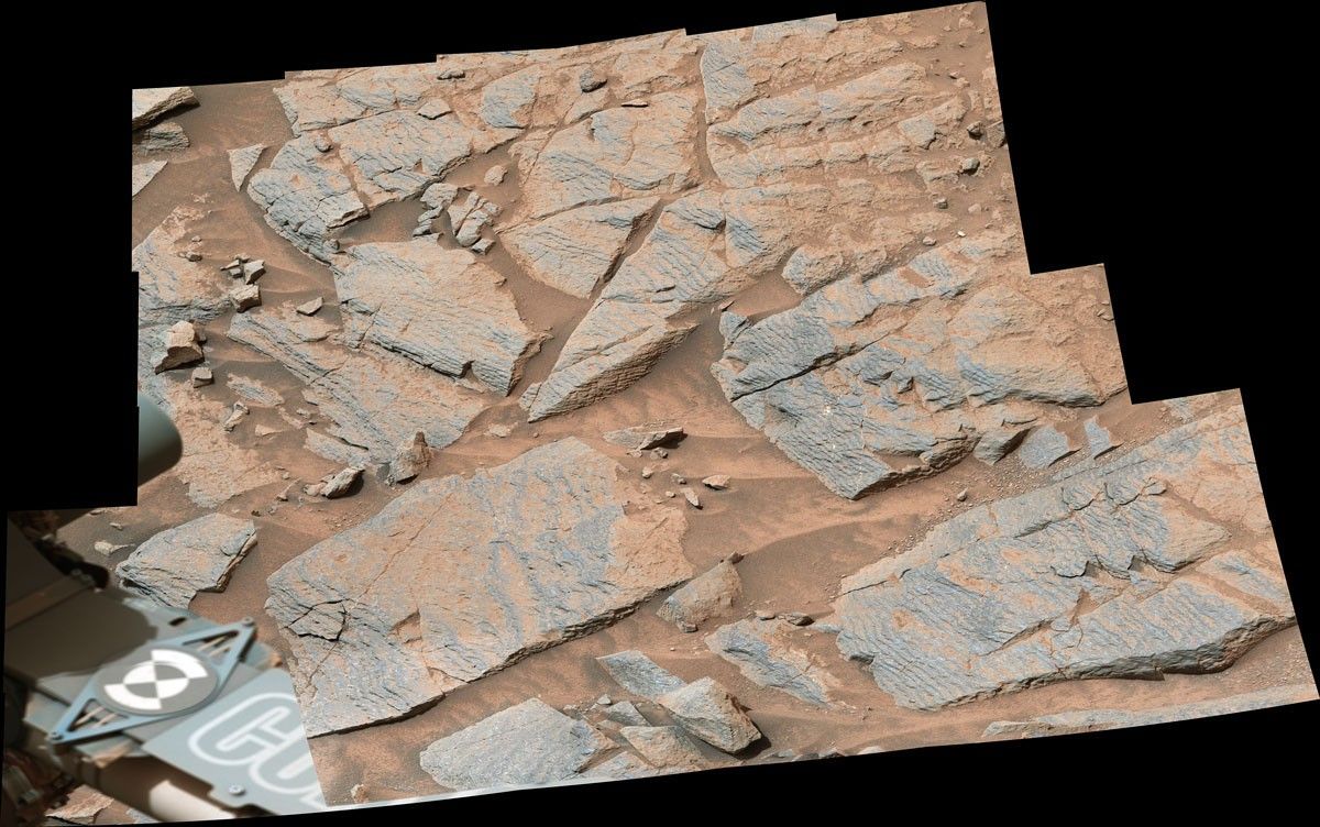 NASA’s Curiosity Mars rover captured this image of rhythmic rock layers with a repetitive pattern in their spacing and thickness.