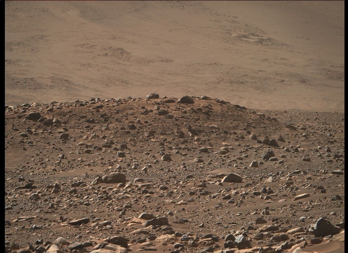 This image of NASA’s Ingenuity Mars Helicopter at “Airfield Mu” was taken by the Mastcam-Z instrument aboard Perseverance on April 14, 2023, the 764th Martian day, or sol, of the rover’s mission.