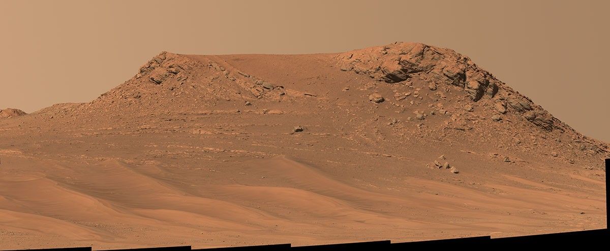 NASA’s Perseverance Mars rover captured this mosaic of a hill nicknamed “Pinestand.” Scientists think the tall sedimentary layers stacked on top of one another here could have been formed by a deep, fast-moving river.