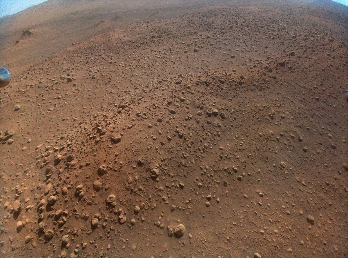 NASA's Ingenuity Mars Helicopter acquired this image using its high-resolution color camera. This camera is mounted in the helicopter's fuselage and pointed approximately 22 degrees below the horizon.